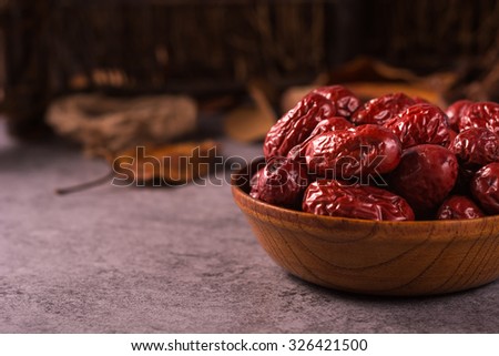 Dried jujube fruit on wooden table