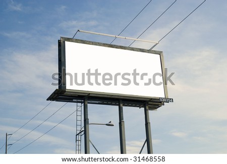 Blank billboard sign with electrical wire and clouds in the background.