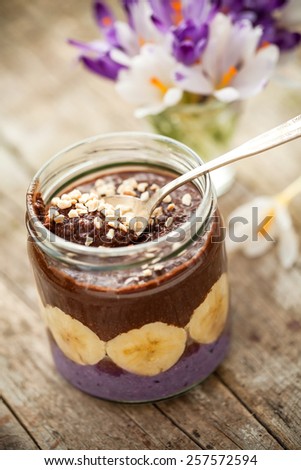 delicious paleo and vegan cocoa porridge with banana and almonds