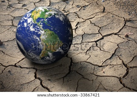 Planet Earth on dry soil, photo of the earth from nasa
