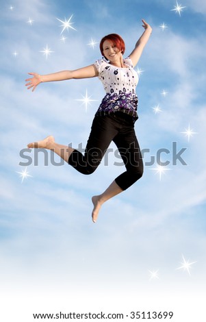Woman jumps against the blue sky with stars