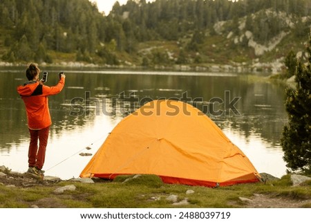 Similar – Image, Stock Photo Unrecognizable woman near forest river