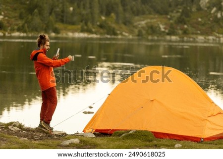 Similar – Image, Stock Photo Unrecognizable woman near forest river