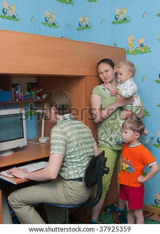 The conflict in a family: the husband plays the computer and does not pay attention to a family