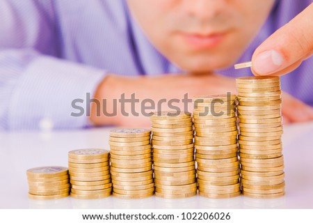 Business man rising coins
