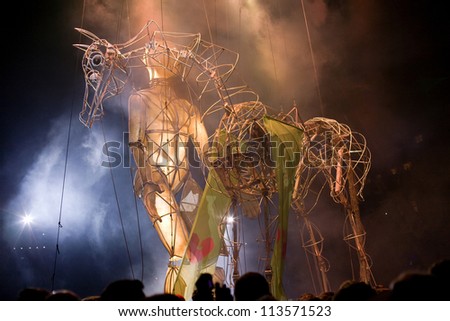 GUIMARAES, PORTUGAL - SEPTEMBER 22: La Fura dels Baus performs with giant puppet and horse during street performances, European capital of culture on 22, 2012 in GUIMARAES, PORTUGAL.