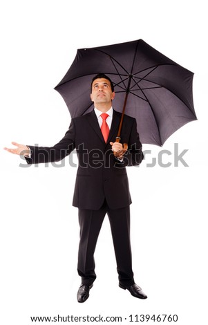 Full body of young business man with umbrella checking if it\'s raining, isolated on white