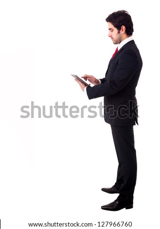 Young business man with tablet computer. Isolated over white background.