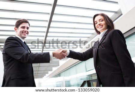 Handshake between business partners at modern office