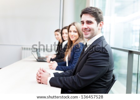 Group of business people smiling at the office lined up