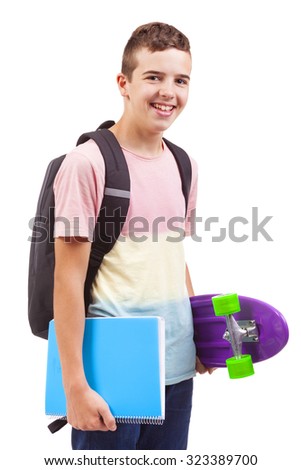 Portrait of a school boy holding a skateboard and notebooks, isolated on white