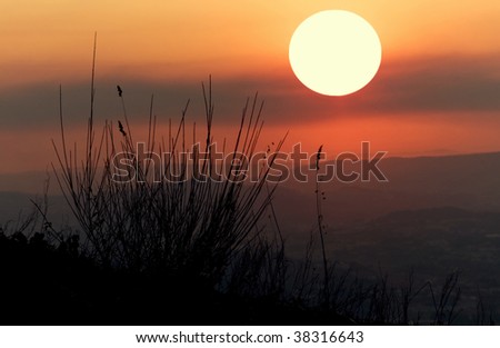 Beautiful sunset in the top of a mountain whith colorful twilight sky