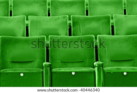 Rows of green seats at an modern university auditorium