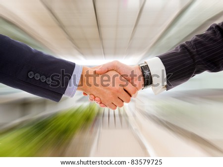 Business man handshake against blur background