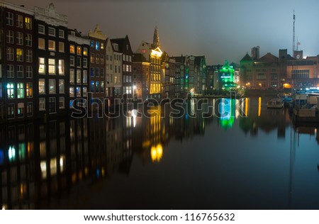 AMSTERDAM,  HOLLAND - OCT 21: Night view of the city of Amsterdam and its canals on Oct 21, 2012 in Amsterdam, Holland.
