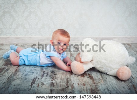 little boy with a plush toy