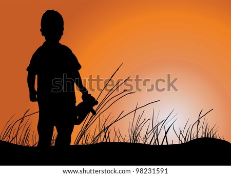 silhouette of a boy on a sunset background