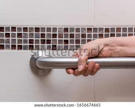 Similar – Image, Stock Photo Man grabs the toilet paper on the toilet