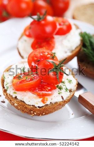 Soft cheese, cherry  tomato and  bread