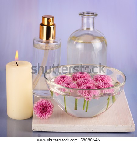 Spa still life with candle and bowl of flower