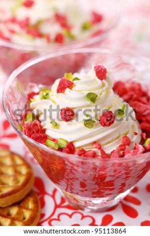 beautiful dessert with rhubarb jam and vanilla, garnished with whipped cream