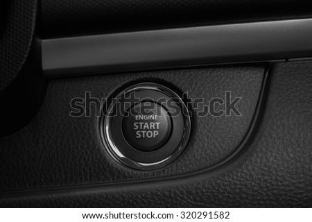 Modern car interior detail. Detail on the start stop button in a car.
