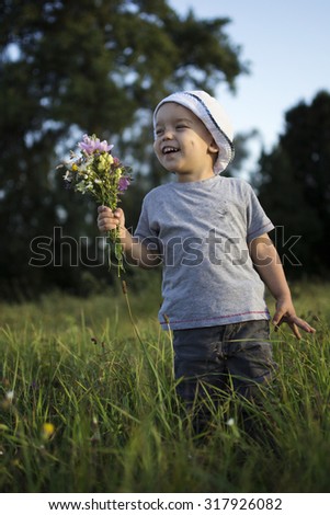 the boy had picked a bouquet of flowers