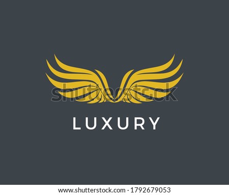 Vector graphic golden wings symbol with sample text for your company