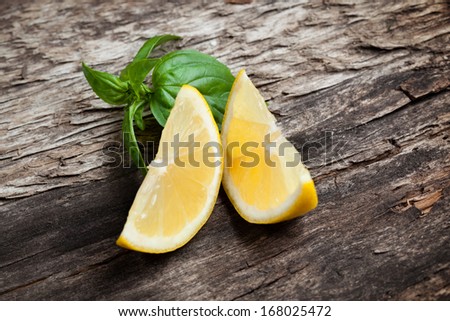 Lemon. Fruit pieces on wooden table. Organic food