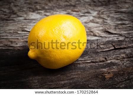 Lemon on wooden table. Organic food