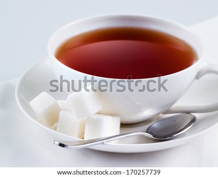 Black tea with sugar cubes