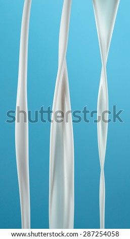 pouring milk splash. Flow isolated on blue. With clipping path.