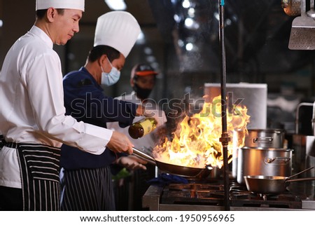 Similar – Image, Stock Photo Kitchen staff in Asian cafe