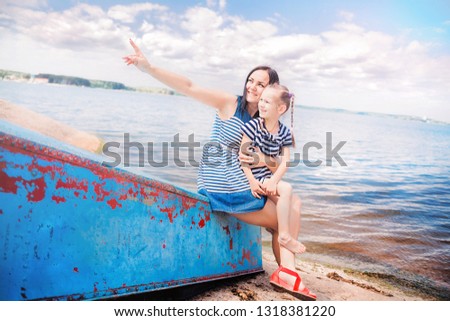 Similar – Foto Bild Mädchen zeigt ihre Hand mit vorübergehenden glänzenden Tätowierungen in Form von blauem Delphin und roten kleinen Eidechsen