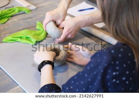 Similar – Image, Stock Photo Crop woman sculpturing pot with clay