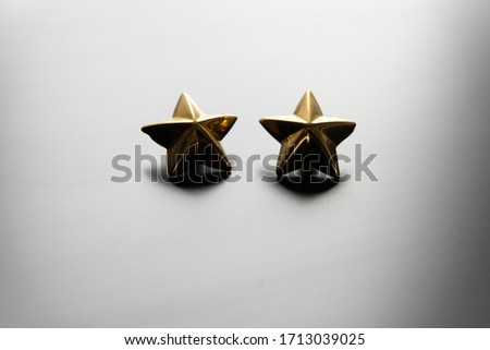 Two golden rank stars close up Stok fotoğraf © 