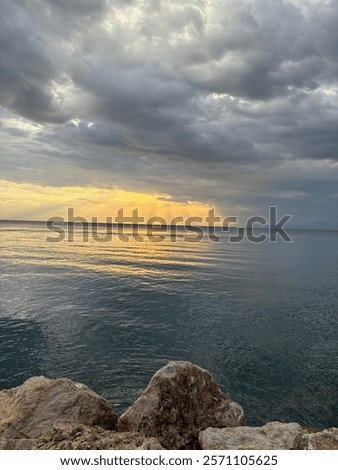 Similar – Image, Stock Photo Sunset Sun Shine Above Sea. Natural Sunrise Sky Warm Colors Over Ripple Sea. Ocean Water Foam Splashes Washing Sandy Beach