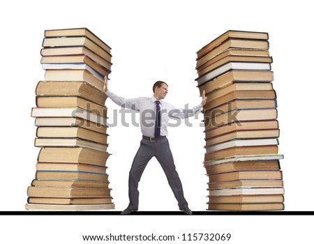 businessman restrains with both hands gripping it from two sides like a vise pile of books - the idea of education, knowledge of congestion, examinations and learning information