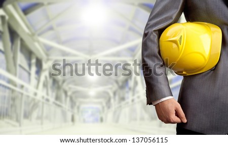 engineer yellow helmet for workers security over crosswalk in the future metal constructions