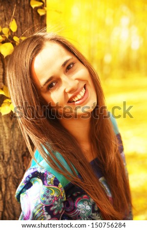 Outdoors portrait of colorful clothed gorgeous fall fashion latin hispanic girl. Copy Space for inscription
