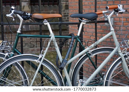 Similar – Foto Bild ein abgestelltes abgeschlossenes Fahrrad