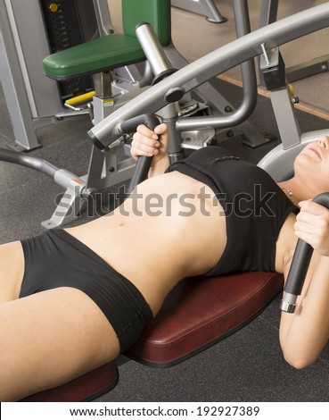 Very sexy hot body of young adult Girls do exercise for legs and hands. in fitness gym on dark floor background woman laying Unrecognizable person No face Copy space for inscription