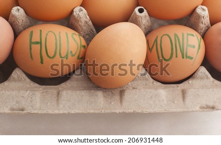 Brown eggs laying in natural cartoon nest packung with painting letter and words  House and money