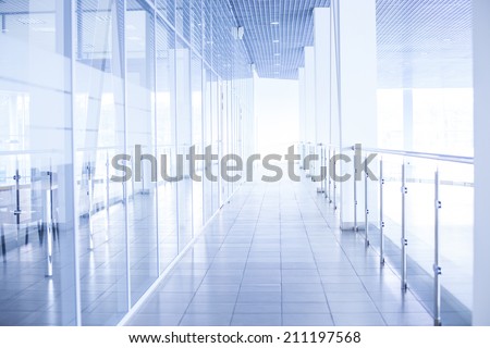 Background of glass corridor in office centre Backdrop of floor roof wall in perspective