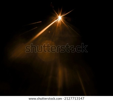 shiny sun, sunbeams, sunrays, sunshine design. Yellow warm light effect, sun rays, golden beams isolated on black background. star dust Foto stock © 