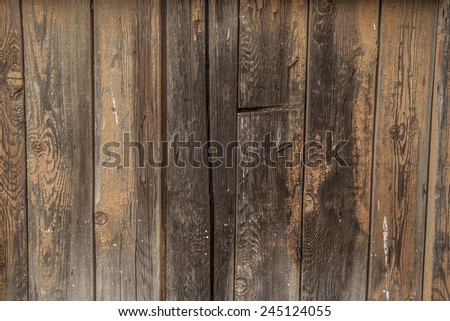 Background of natural material of Old retro vintage aged natural yellow painted wooden board shabby backdrop close up Dramatic light on surface