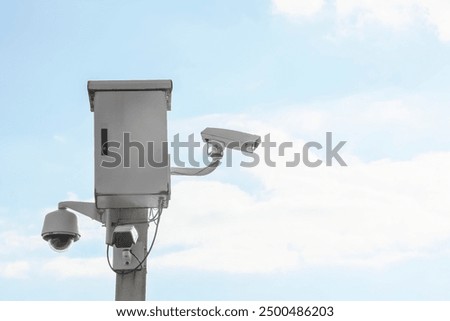 Similar – Image, Stock Photo Pole with city cameras against blue sky