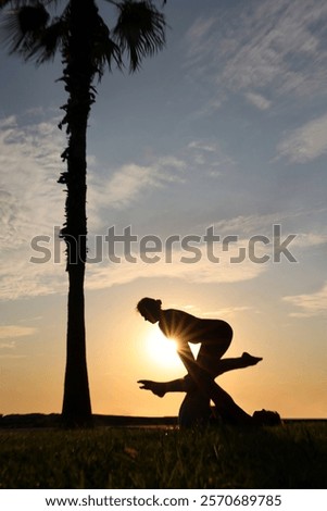 Similar – Image, Stock Photo Man doing acrobatic in the beach. Moody weather and rain