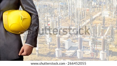 engineer or electricity industrial worker hold in hand yellow helmet hard hat electric High voltage power transformer substation No face unrecognizable person Idea safe sign safety symbol of security