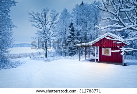 A dark winter evening in a warm and cozy cabin